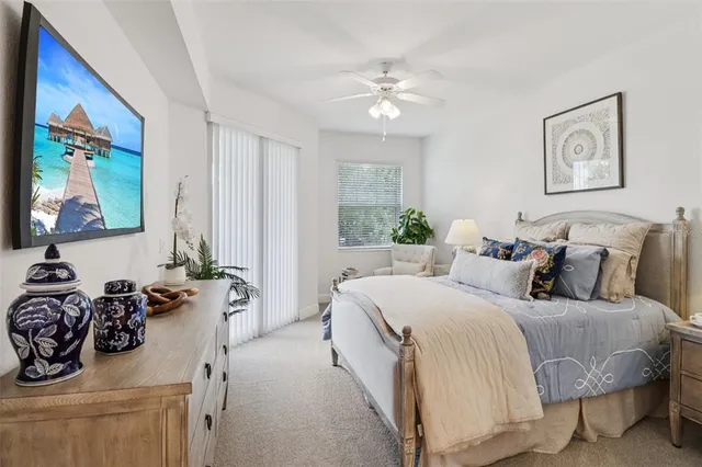 a bedroom with bed and a couch