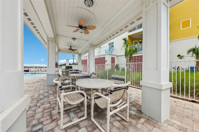 a view of a patio with a dining table and chairs