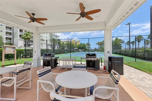 a view of a backyard with sitting area