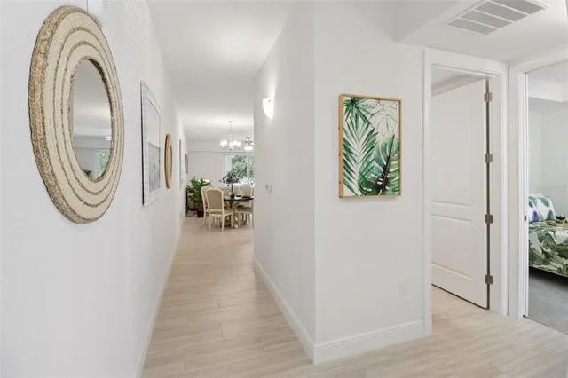 a living room with furniture and a ceiling fan