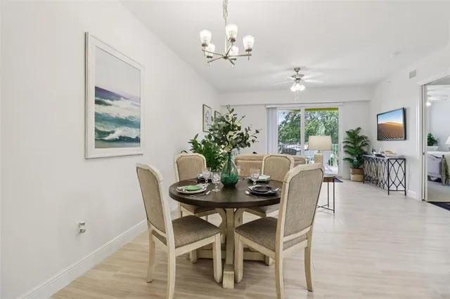 a kitchen with granite countertop a refrigerator stove top oven and sink