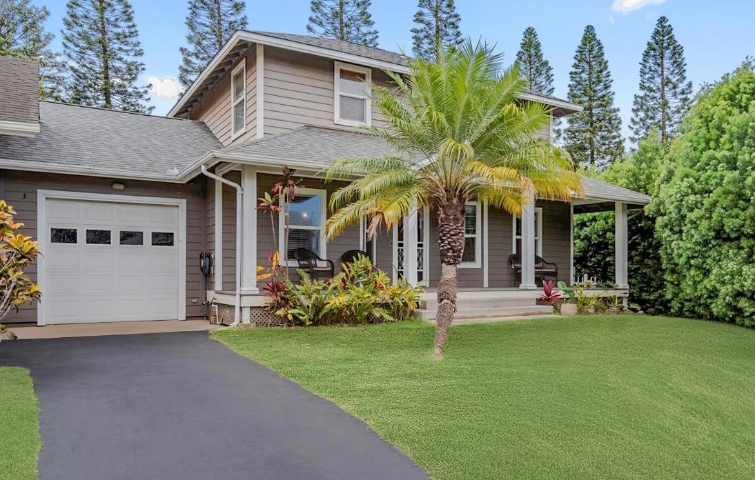 a front view of a house with garden and porch