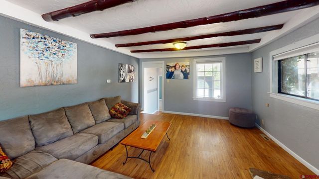 a living room with furniture and a window