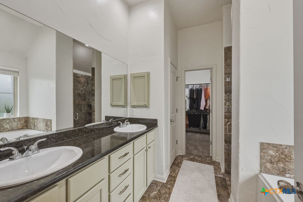 3306 Spring Canyon Road Belton, TX 76513 - Photo 24 of 40 a bathroom with a sink and a mirror