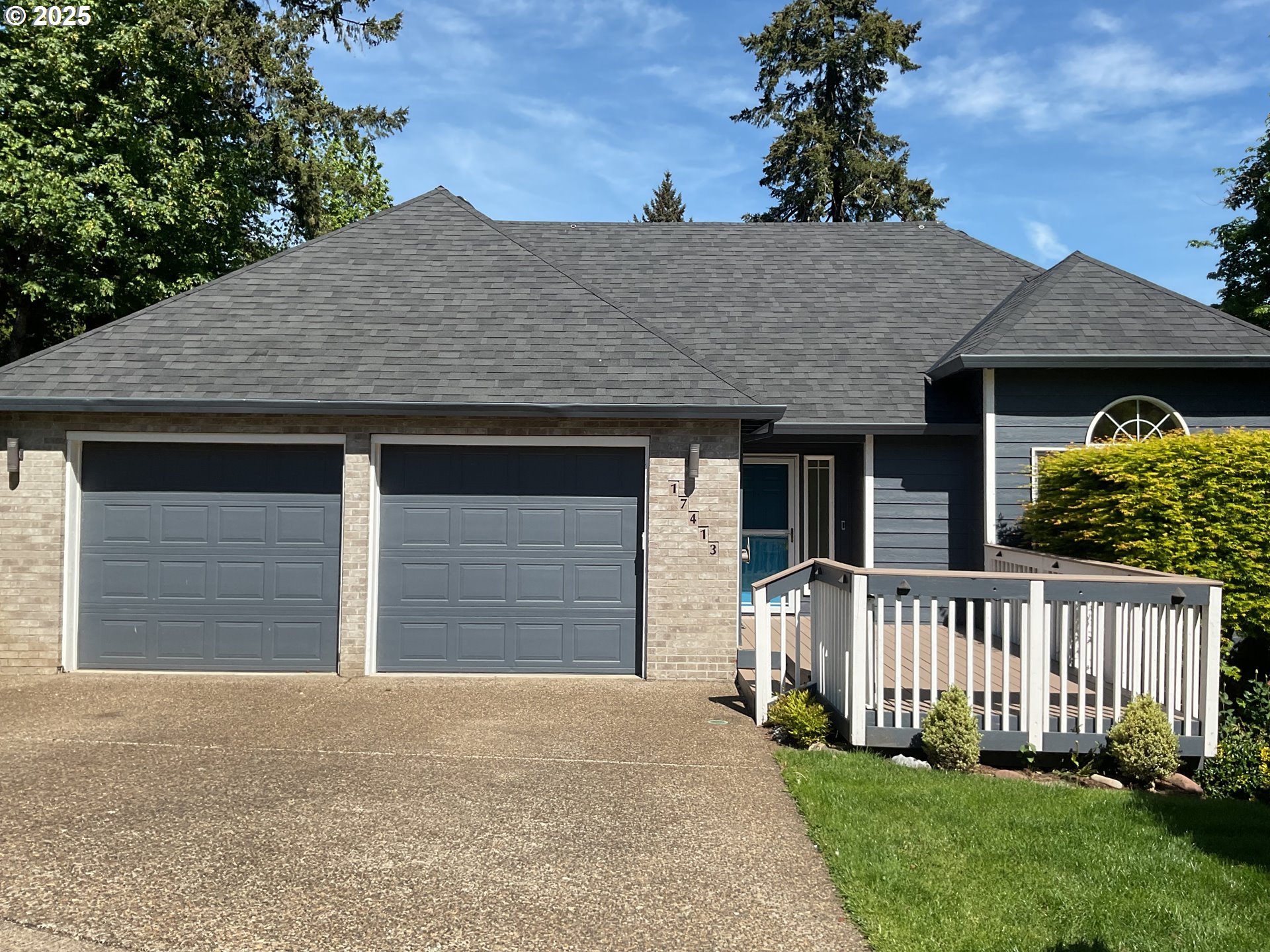 a front view of a house with a garden