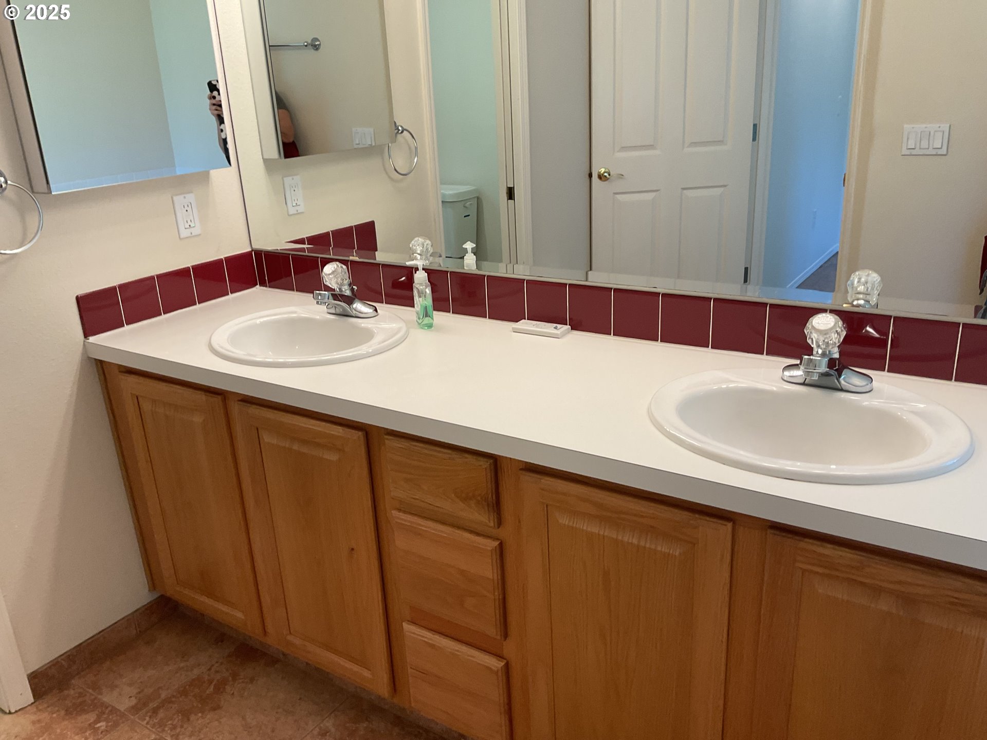 17413 Wake Robin Circle Oregon City, OR 97045 - Photo 15 of 27 a bathroom with a sink and a mirror