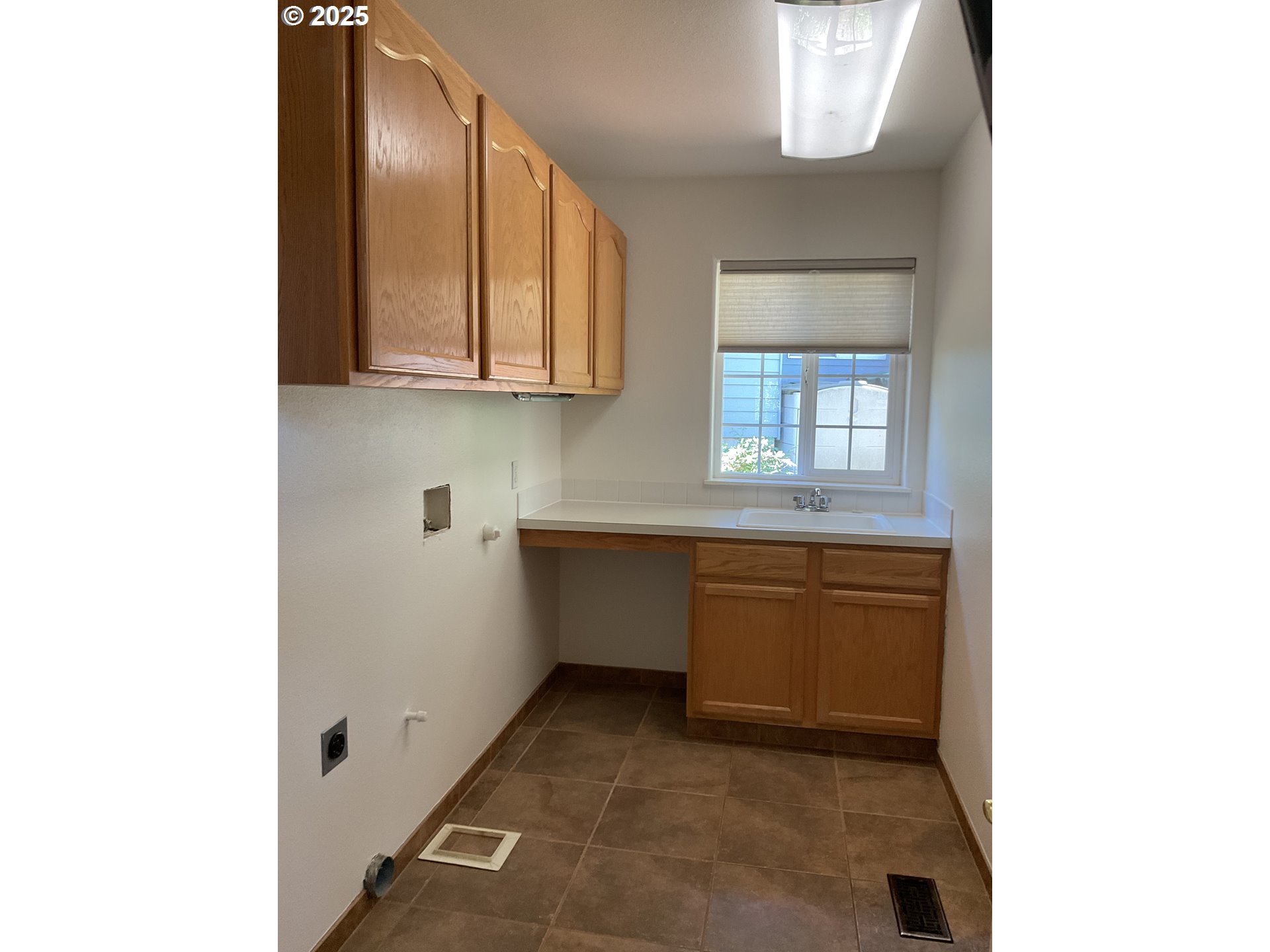 17413 Wake Robin Circle Oregon City, OR 97045 - Photo 16 of 27 a kitchen with granite countertop white cabinets and window