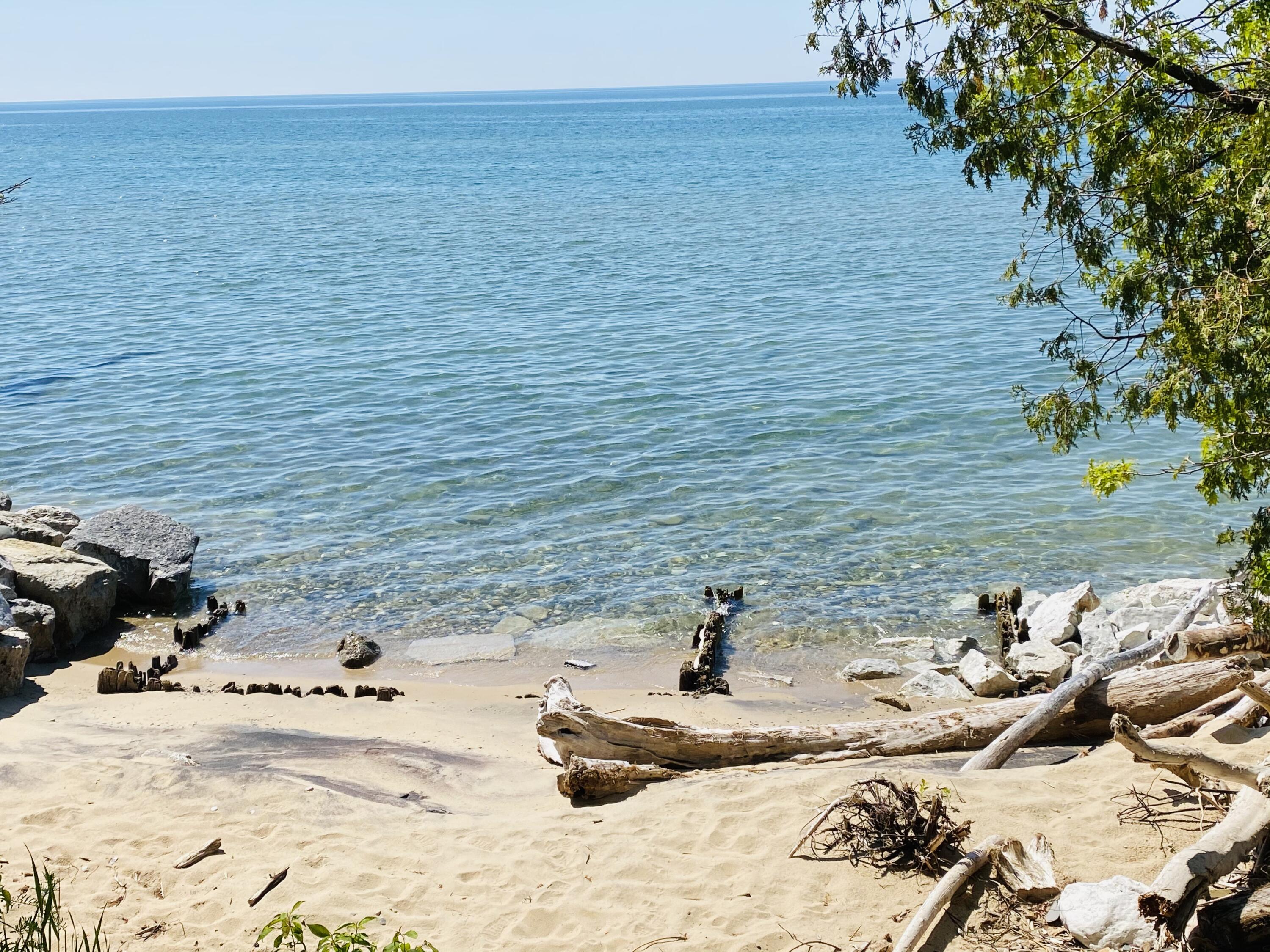 3417 Lakeshore Road Manistee, MI 49660 - Photo 2 of 35 Lake Michigan access across from home!