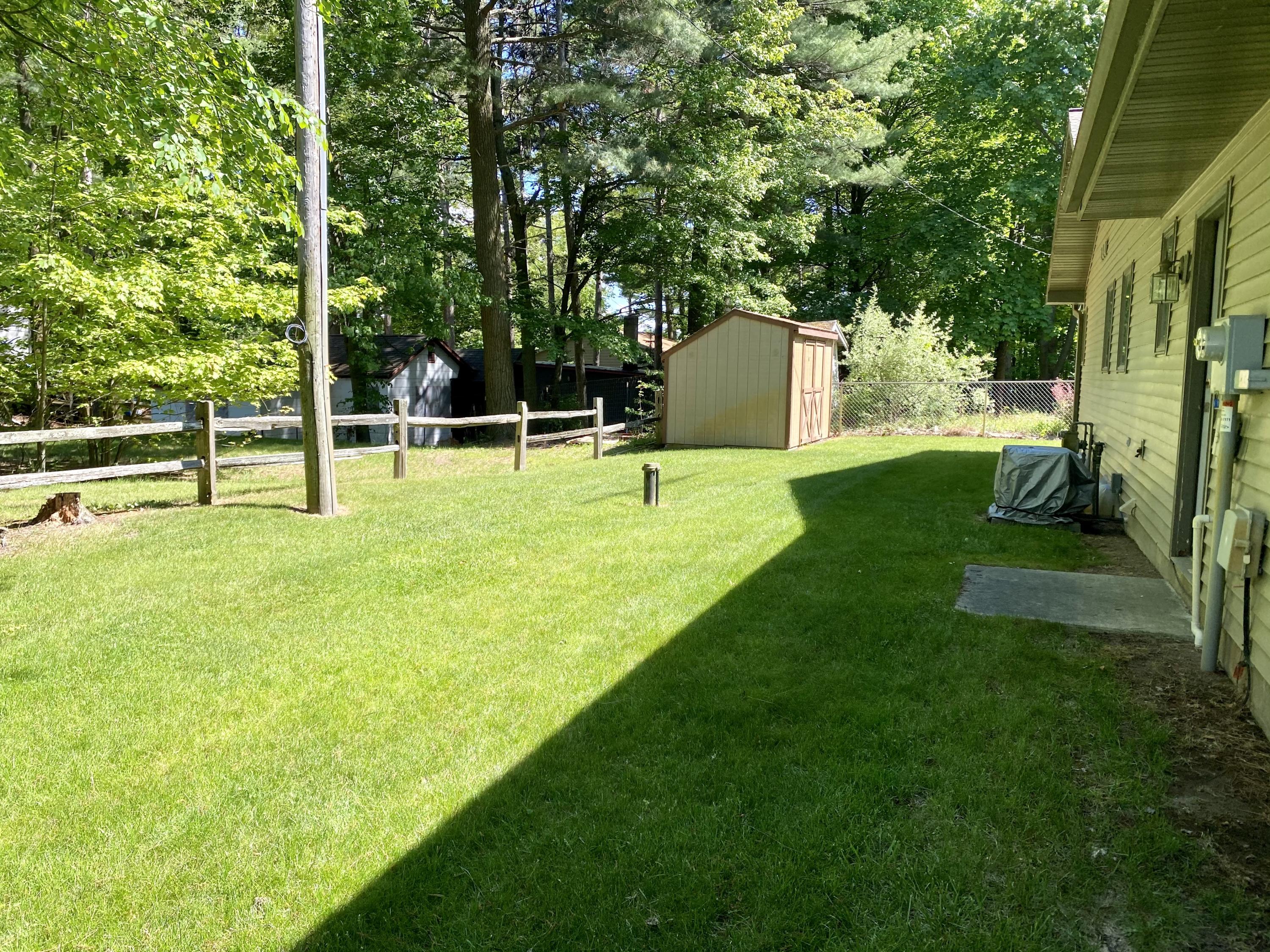 3417 Lakeshore Road Manistee, MI 49660 - Photo 28 of 35 Nice backyard