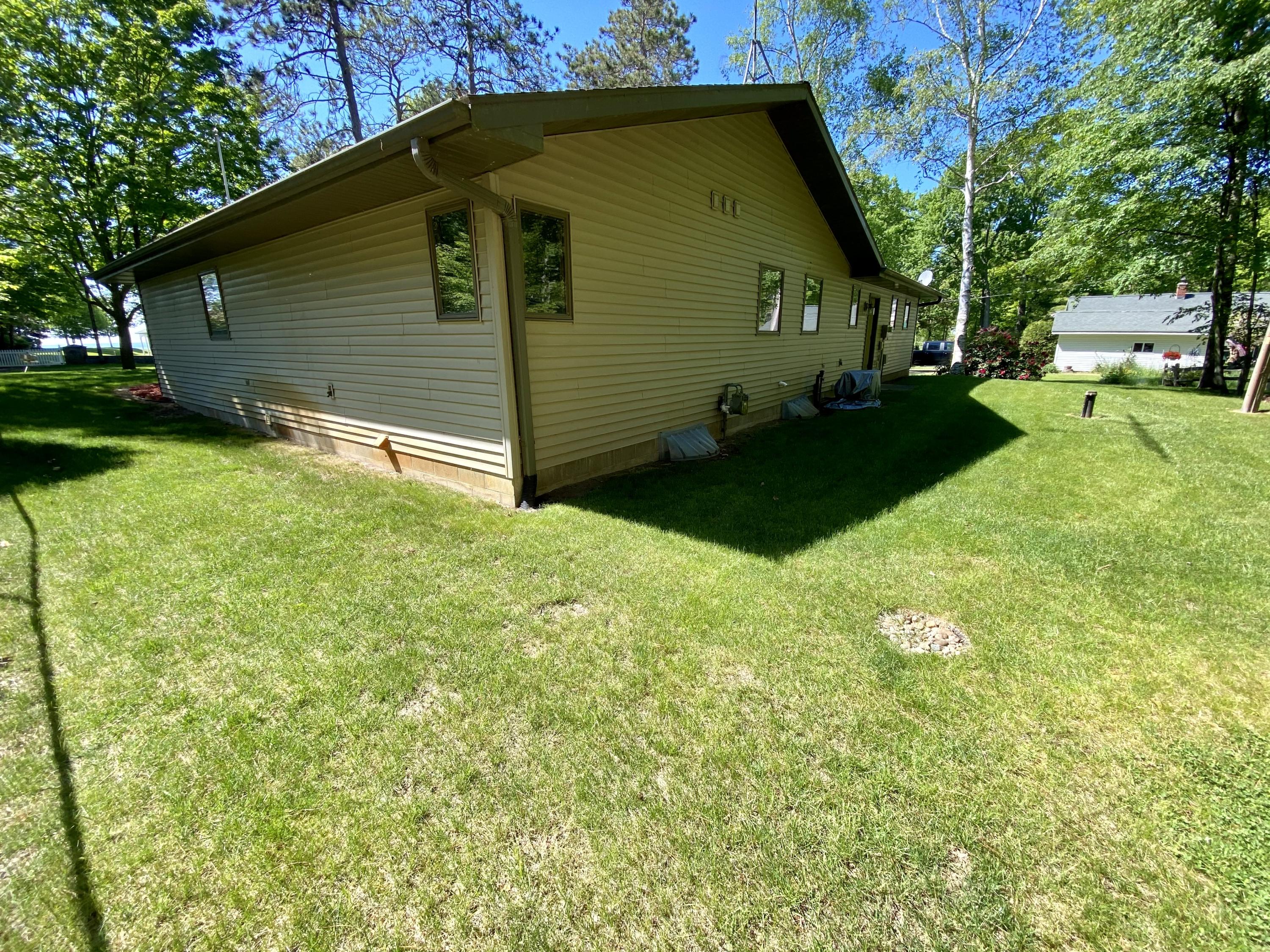 3417 Lakeshore Road Manistee, MI 49660 - Photo 31 of 35 Side yard