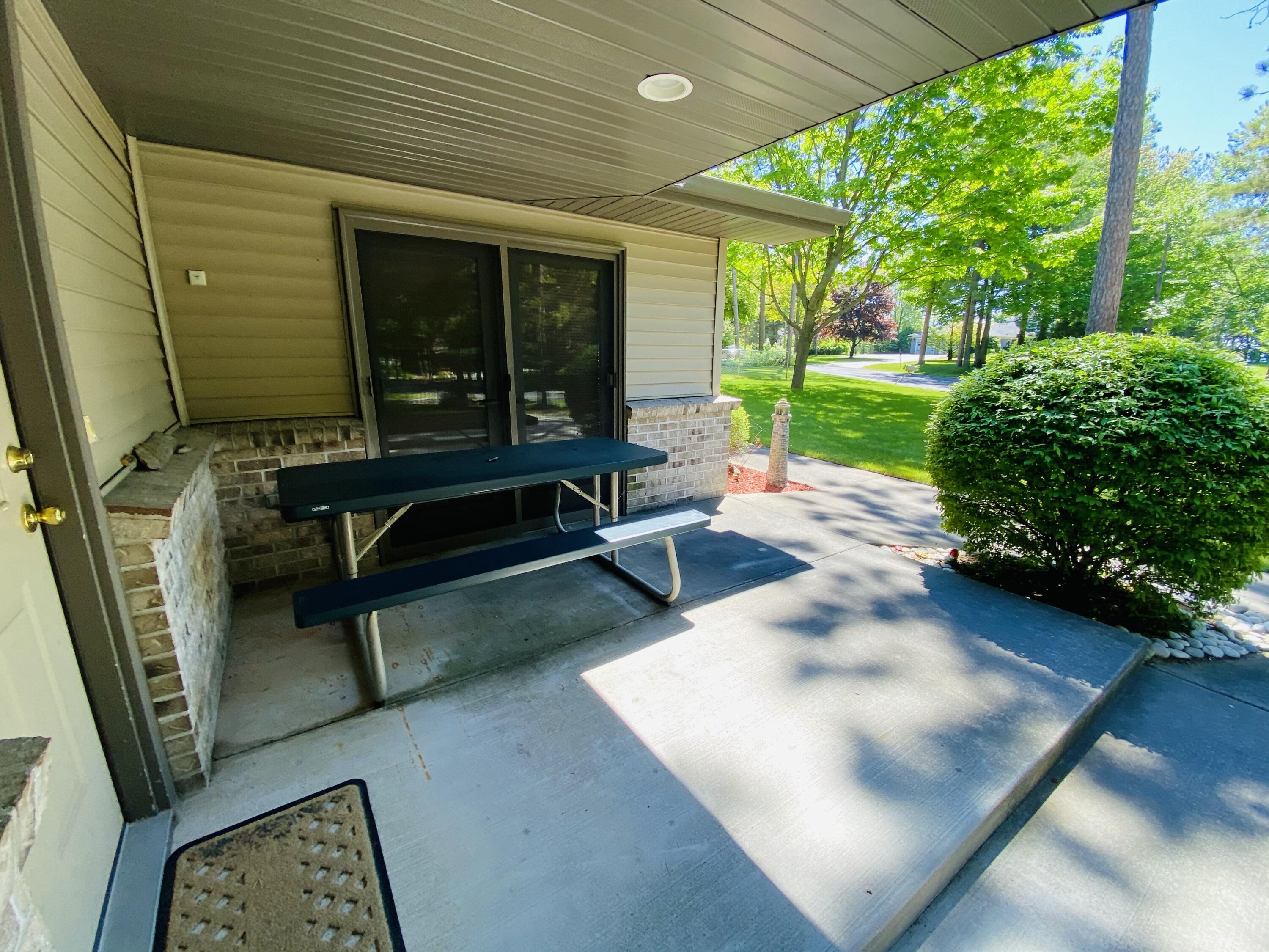 3417 Lakeshore Road Manistee, MI 49660 - Photo 5 of 35 Front patio