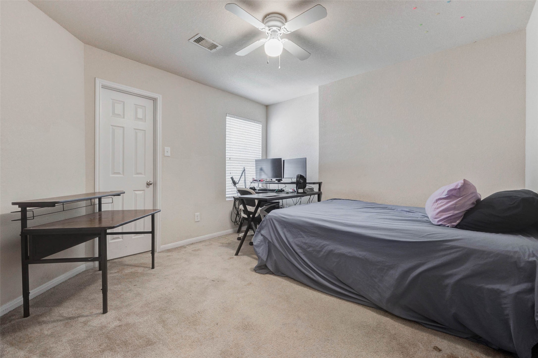 3027 Upland Spring Trace Katy, TX 77493 - Photo 22 of 29 a bedroom with a bed and a chandelier