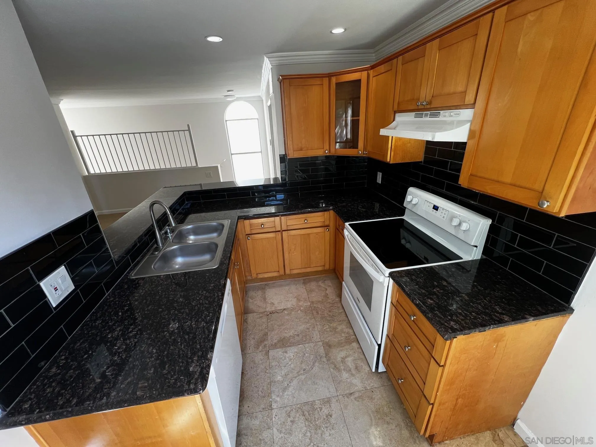 4881 Collwood Boulevard, Unit B San Diego, CA 92115 - Photo 1 of 17 a kitchen with granite countertop a stove and a sink