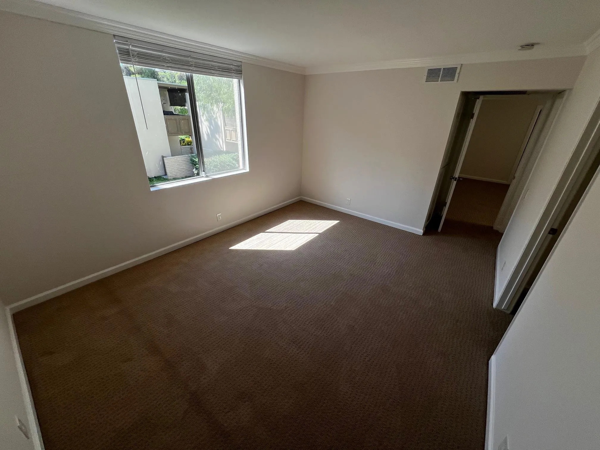 4881 Collwood Boulevard, Unit B San Diego, CA 92115 - Photo 4 of 17 an empty room with windows