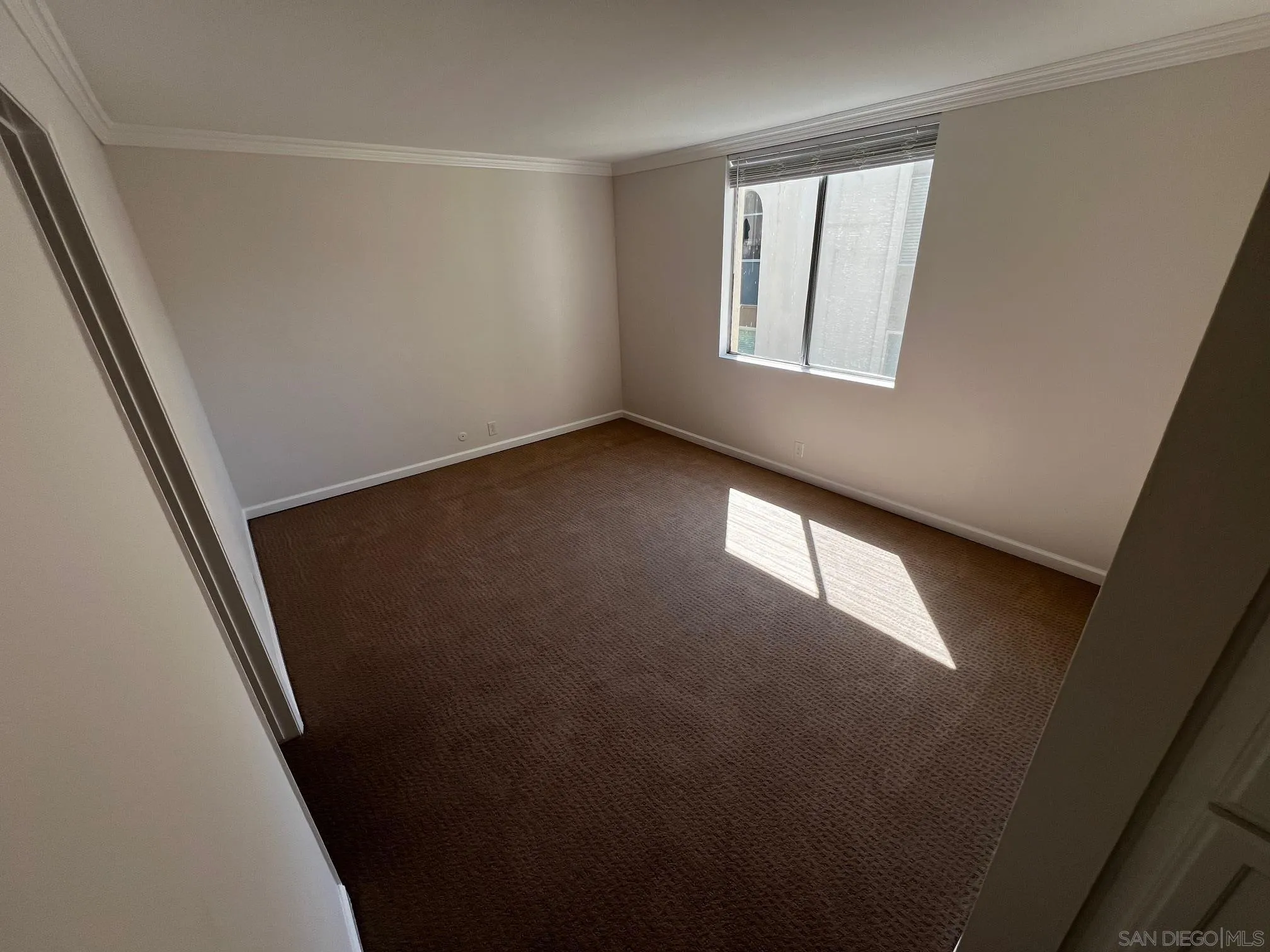 4881 Collwood Boulevard, Unit B San Diego, CA 92115 - Photo 5 of 17 an empty room with windows
