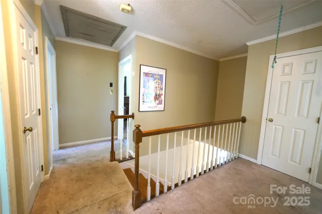 a view of a hallway with a bedroom