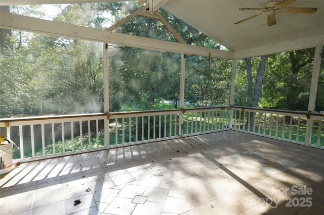 a view of balcony with yard