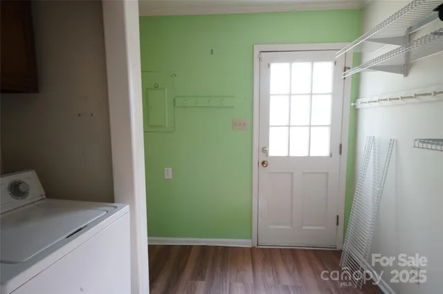 a room with a window and wooden floor