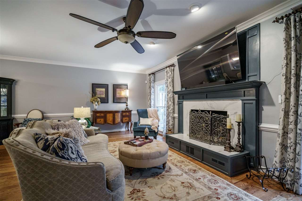 772 Weathergreen Drive Raleigh, NC 27615 - Photo 14 of 26 Wood burning fireplace with marble surround and upgraded millwork. Fireplace