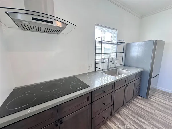 a kitchen with a sink and cabinets