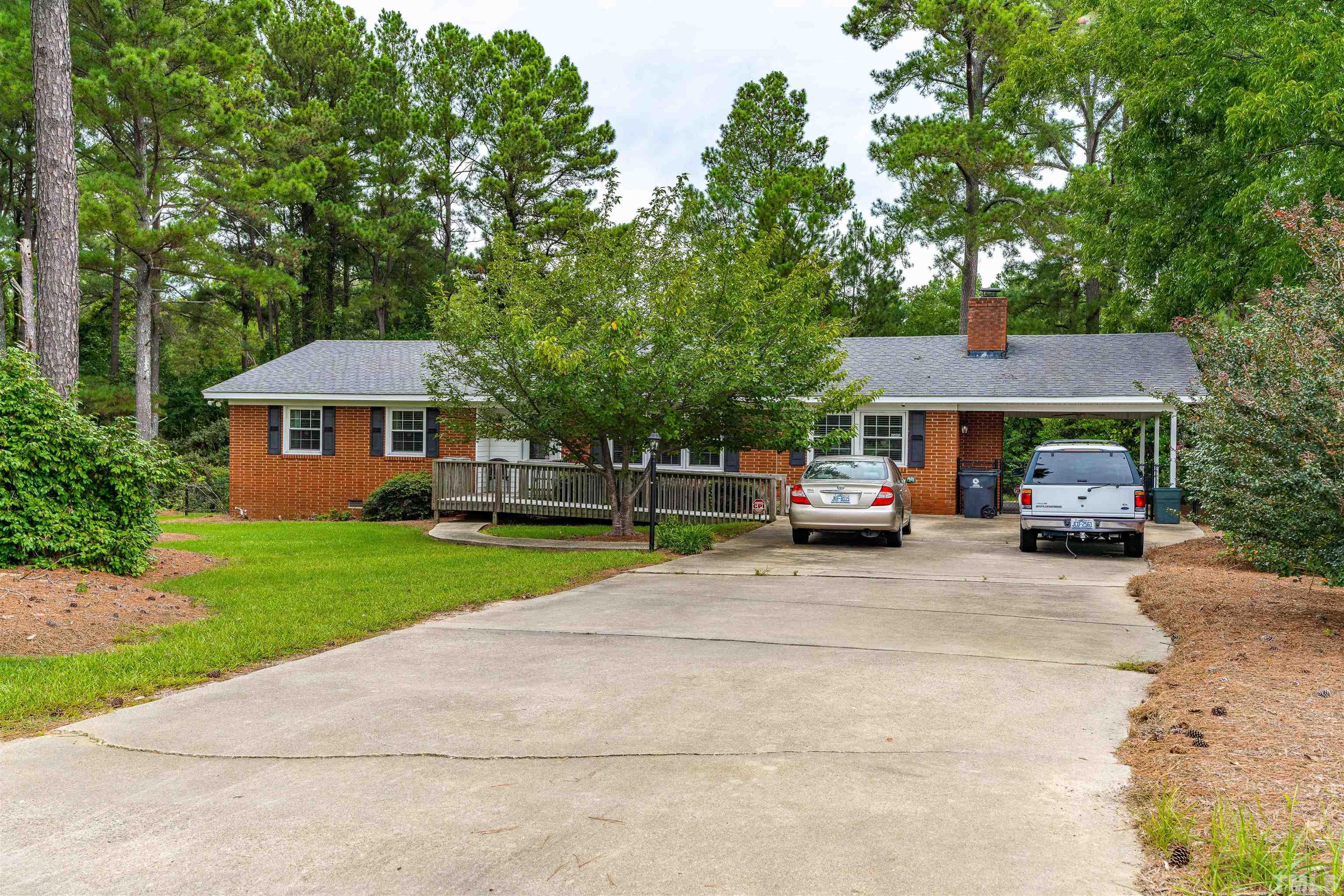 2052 Jack Road Clayton, NC 27520 - Photo 4 of 37 a view of house with car parked beside of road