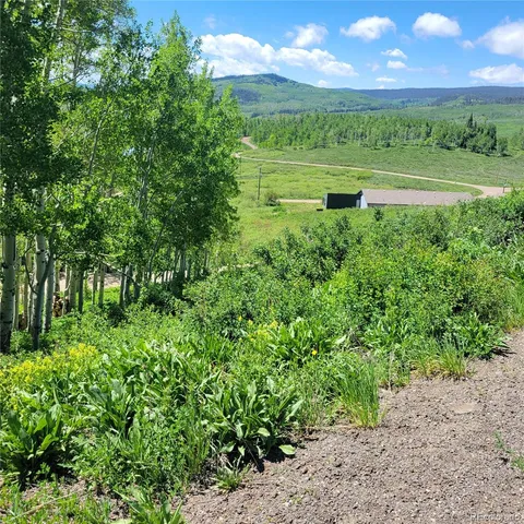 a view of a lake with a big yard