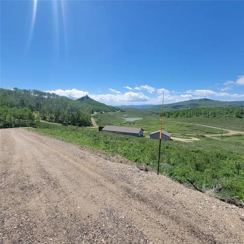 a view of a road with a yard