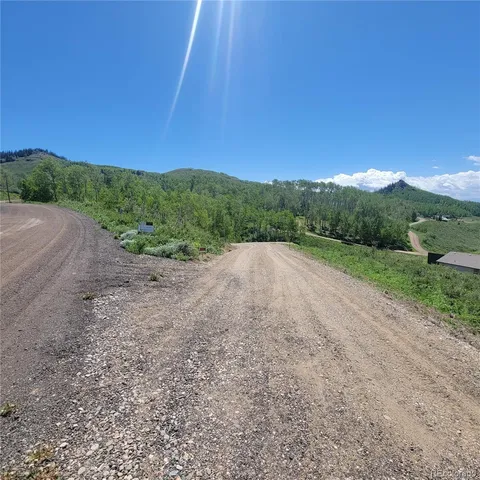 a view of a road with a yard