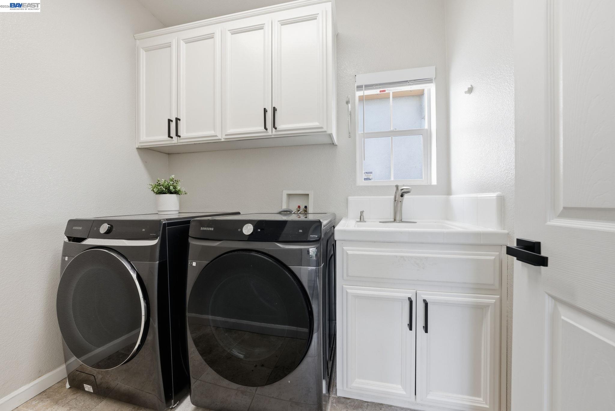 Westside San Ramon, CA 94583 - Photo 36 of 43 a utility room with sink dryer and washer