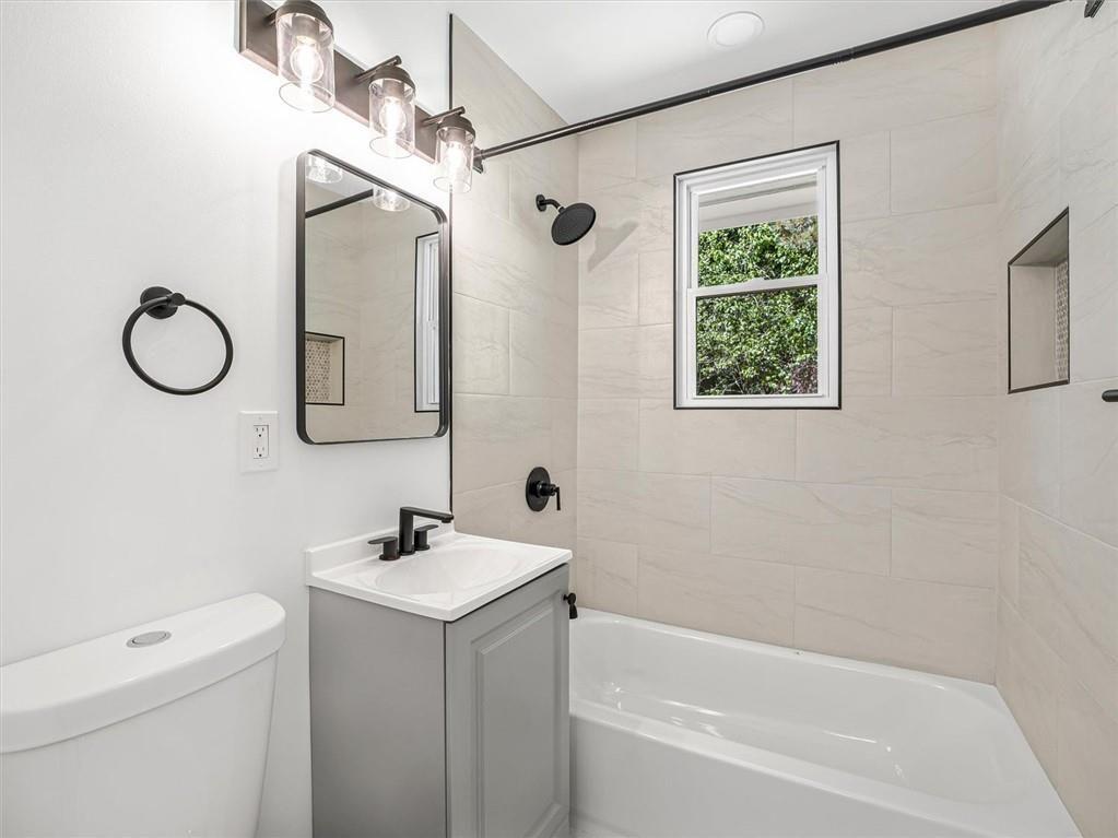 454 Oak Drive Southeast Atlanta, GA 30354 - Photo 19 of 29 a bathroom with a sink a toilet and shower