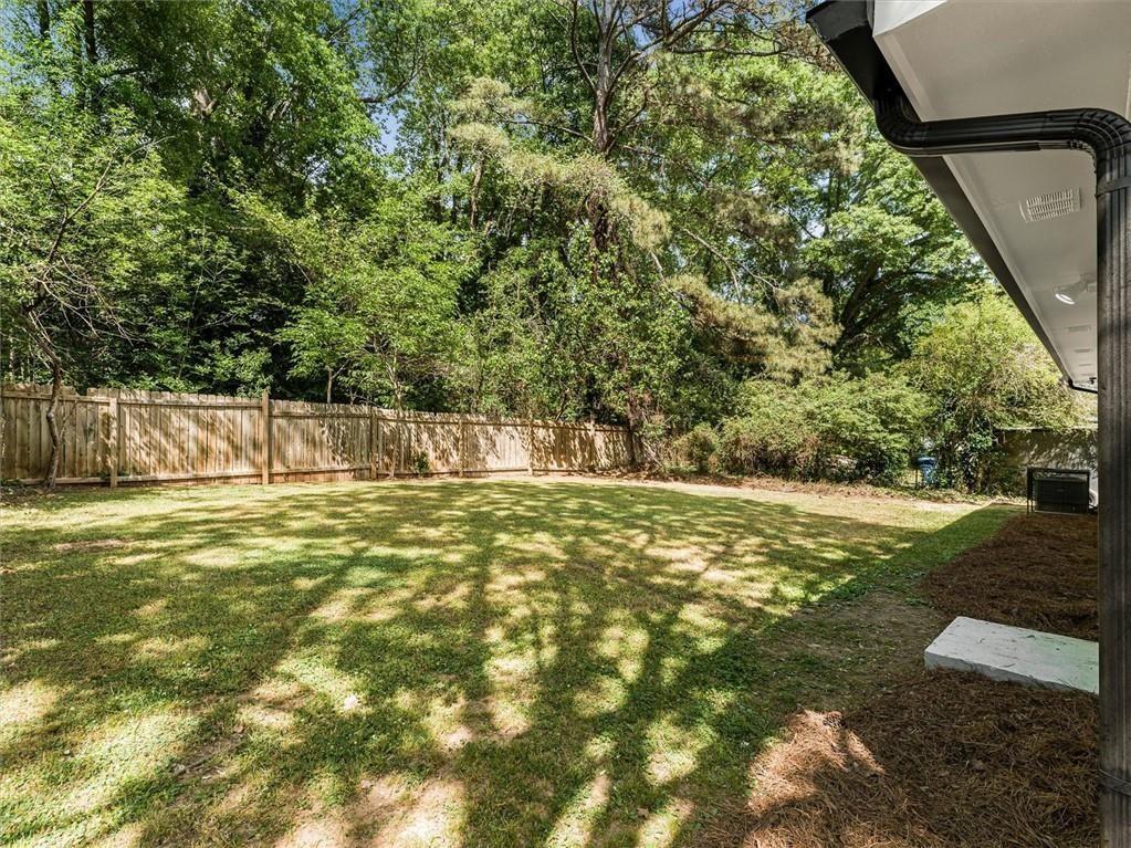 454 Oak Drive Southeast Atlanta, GA 30354 - Photo 25 of 29 a view of a yard with a large tree