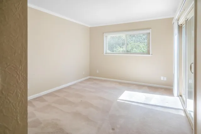 a view of a balcony with wooden floor and fence