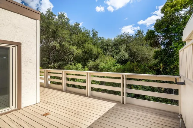 a view of balcony with wooden floor