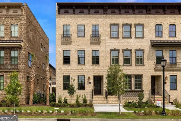 a front view of a building with garden