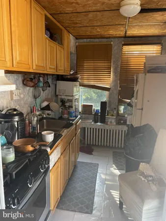 a living room with furniture a dining table and chairs with wooden floor