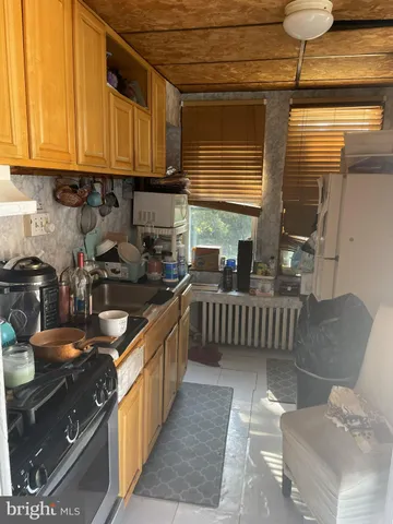 a living room with furniture a dining table and chairs with wooden floor