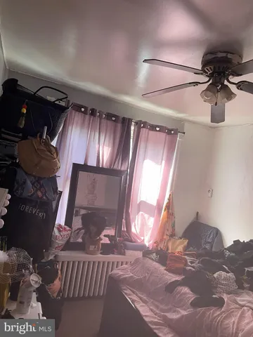 a roof deck with couches and wooden floor