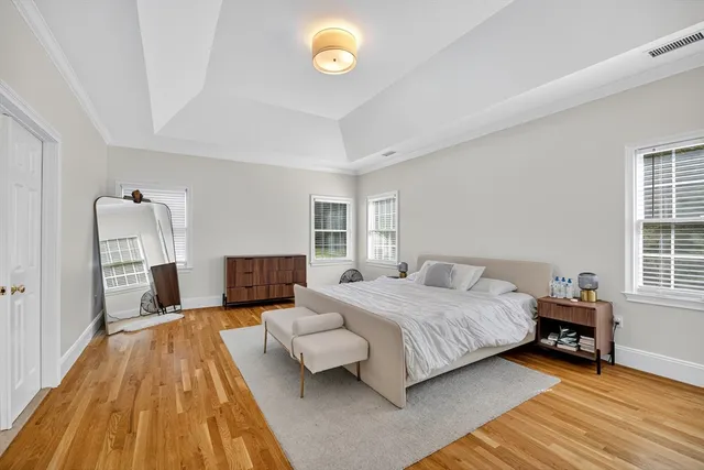 a bedroom with a bed and a table