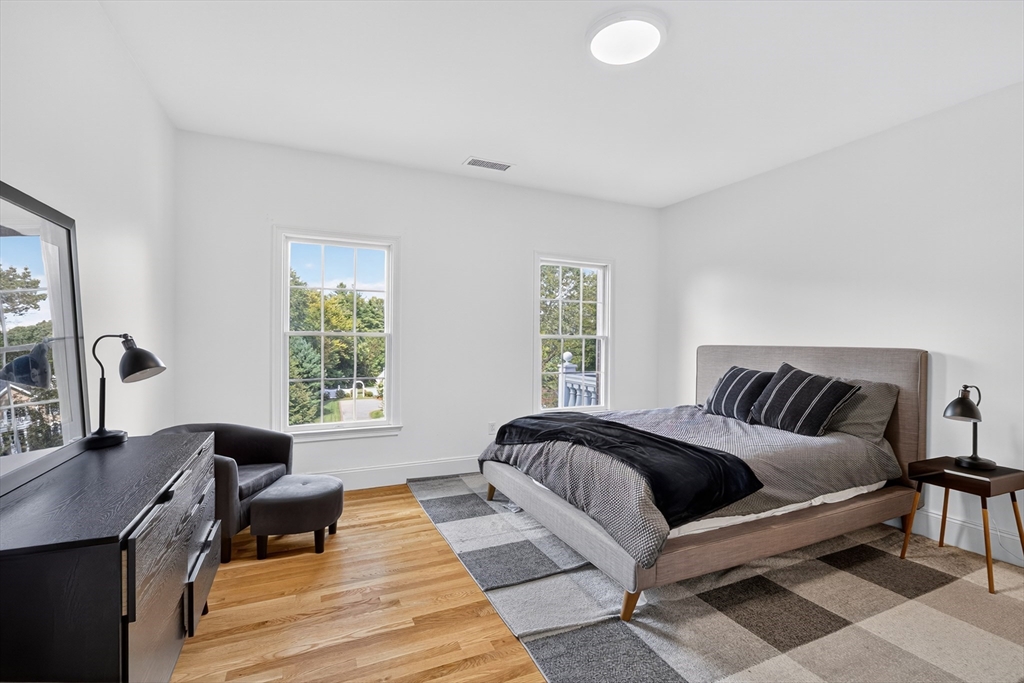 4 Summit Way, Unit 1 Hopkinton, MA 01748 - Photo 21 of 27 a bedroom with a bed and a desk