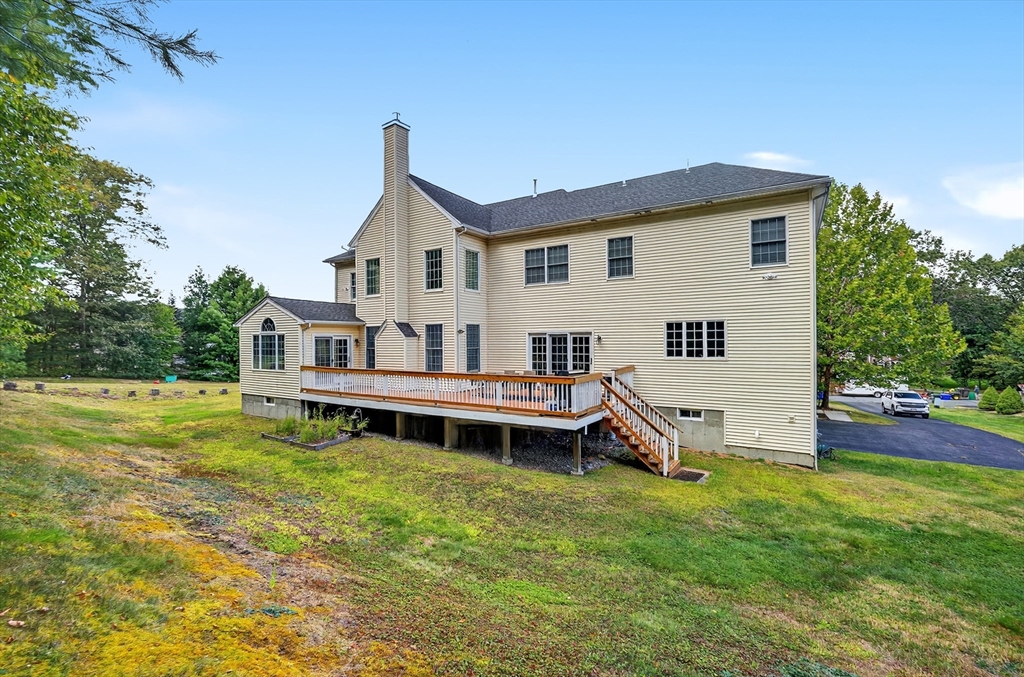 4 Summit Way, Unit 1 Hopkinton, MA 01748 - Photo 25 of 27 a view of a house with a yard and sitting area