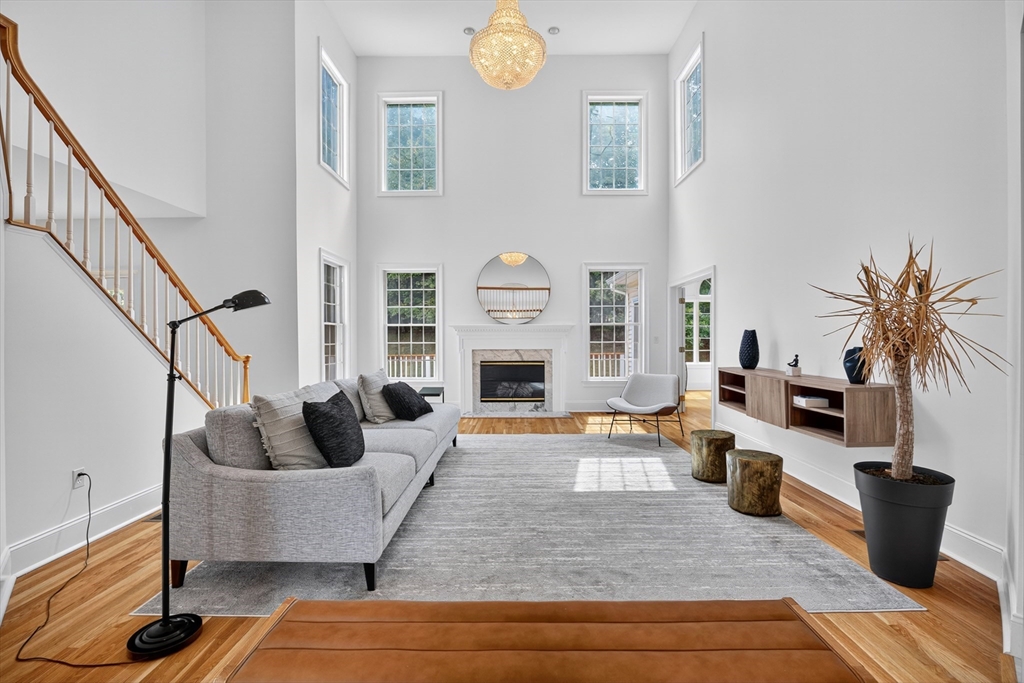 4 Summit Way, Unit 1 Hopkinton, MA 01748 - Photo 3 of 27 a living room with furniture and a fireplace