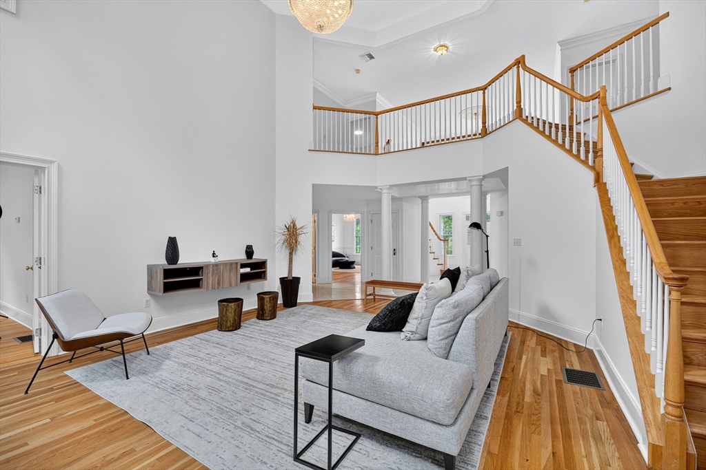 4 Summit Way, Unit 1 Hopkinton, MA 01748 - Photo 5 of 27 a living room with furniture and a wooden floor