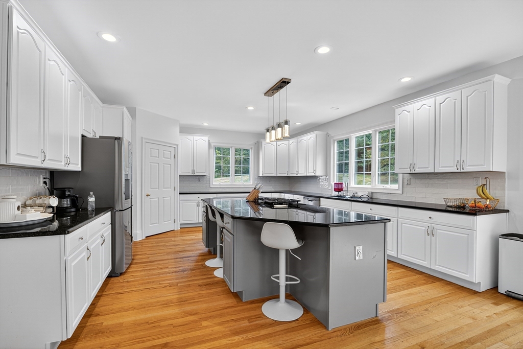 4 Summit Way, Unit 1 Hopkinton, MA 01748 - Photo 10 of 27 a kitchen with stainless steel appliances a sink and stove
