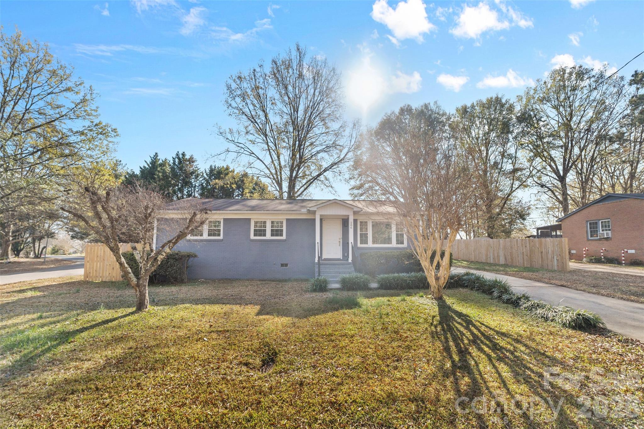 206 Hunter Street York, SC 29745 - Photo 16 of 20 a front view of a house with a yard covered with snow