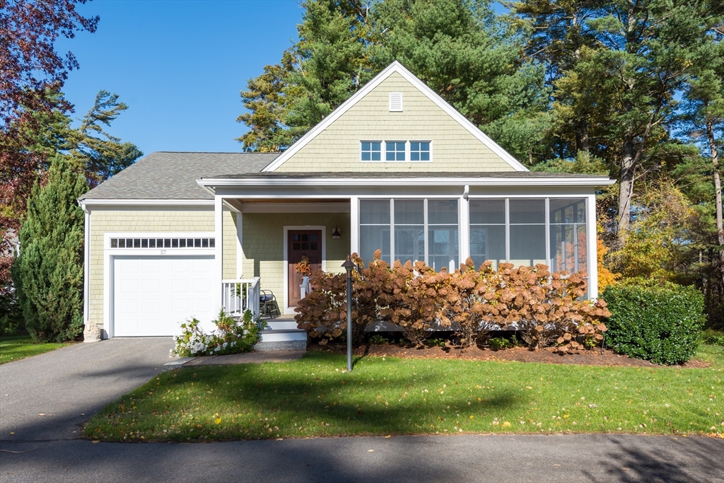 57 Hathaway Pond Circle, Unit 57 Rochester, MA 02770 - Photo 1 of 40 a front view of a house with garden