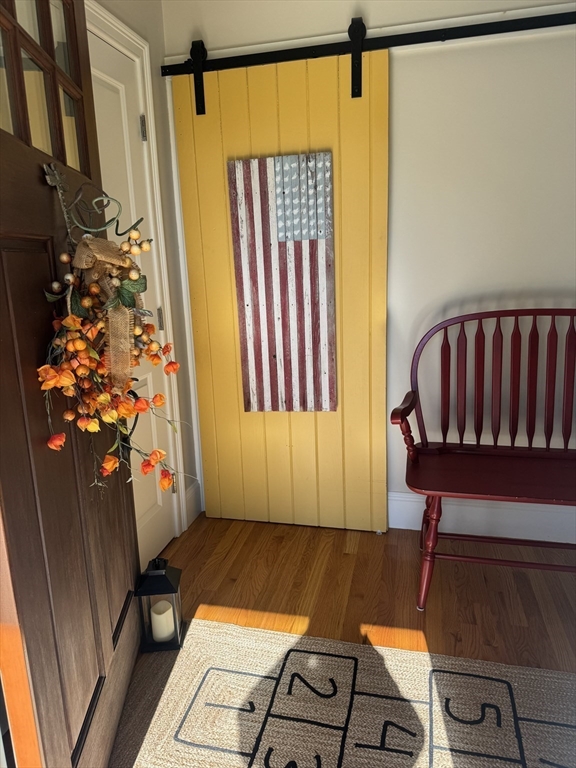 57 Hathaway Pond Circle, Unit 57 Rochester, MA 02770 - Photo 11 of 40 a view of a living room with furniture and a rug