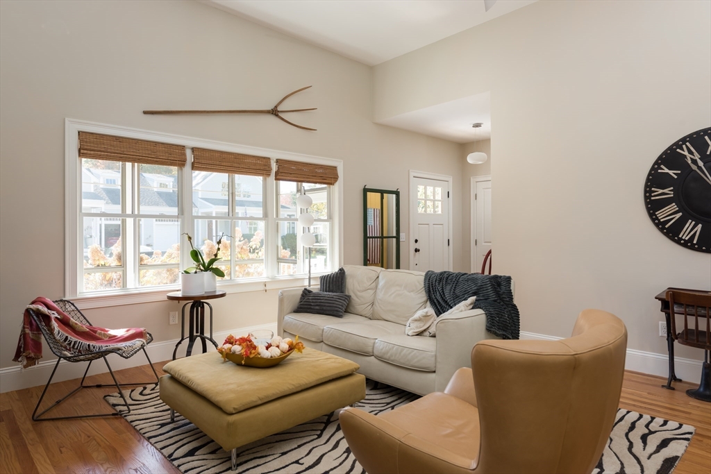 57 Hathaway Pond Circle, Unit 57 Rochester, MA 02770 - Photo 13 of 40 a living room with furniture and a large window