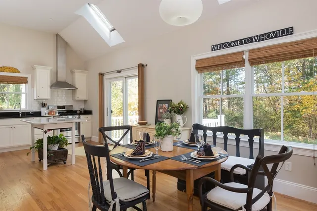 a kitchen with a sink a window and cabinets