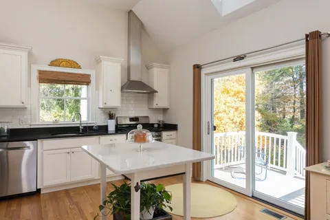 a kitchen with a white cabinets and stainless steel appliances