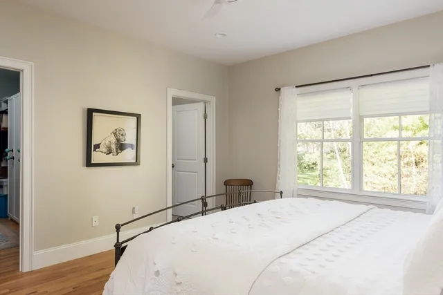 a bedroom with a bed and a table